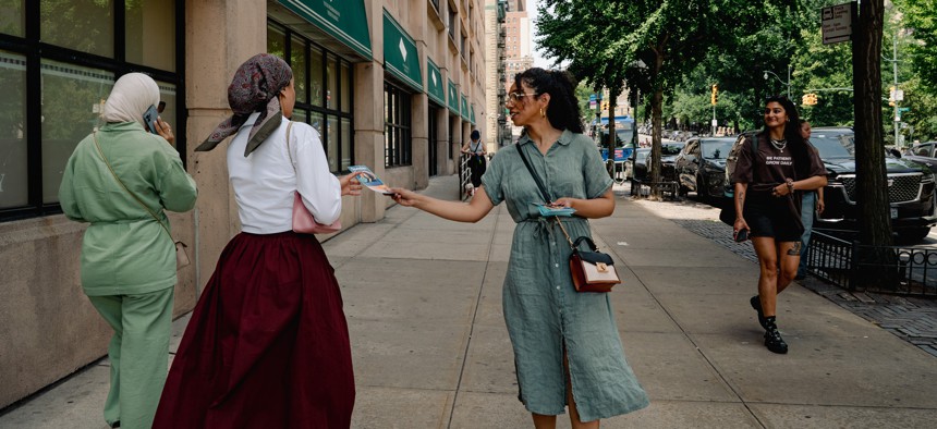 Darializa Avila Chevalier, Democratic candidate for Congress in New York's 13th Congressional District, hands out campaign flyers in the Morningside Heights neighborhood of Manhattan on June 14, 2026, in New York, NY.