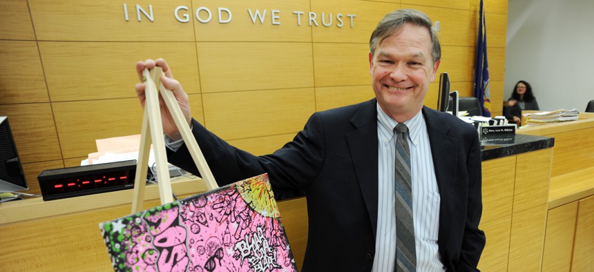 Brooklyn Family Court Judge Lee Elkins poses with "Pink Stink" by Christian Garcia at an art show in his courtroom on January 25, 2011.