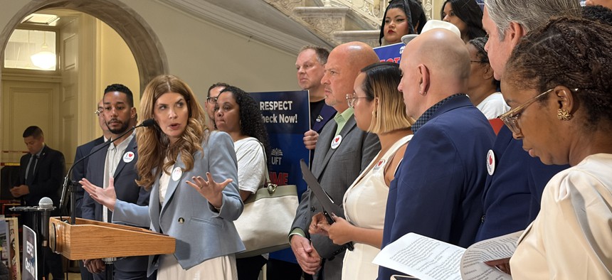City Council Speaker Julie Menin and United Federation of Teachers President Michael Mulgrew rally ahead of the vote to give paraprofessionals a one-time bonus.