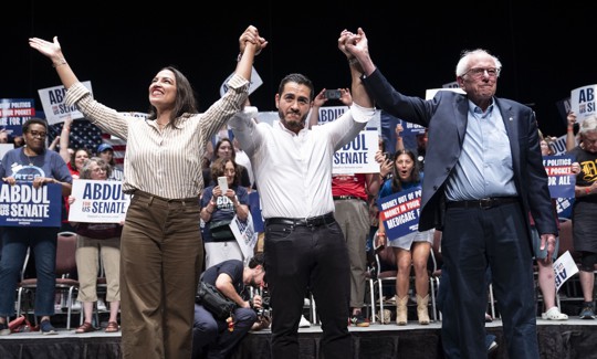 Rep. Alexandria Ocasio-Cortez, left, and U.S. Sen. Bernie Sanders, right, campaign with Abdul El-Sayed in Detroit on July 18, 2026.