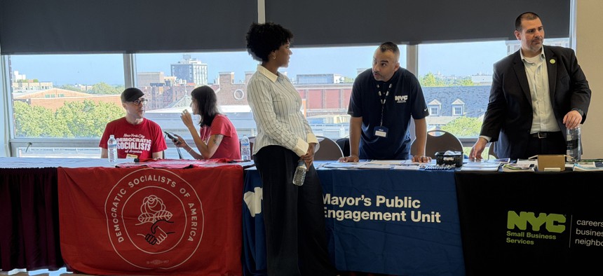 NYC-DSA members table alongside government agencies at the Mamdani’s administration’s bus rider town hall on Aug. 6, 2026.