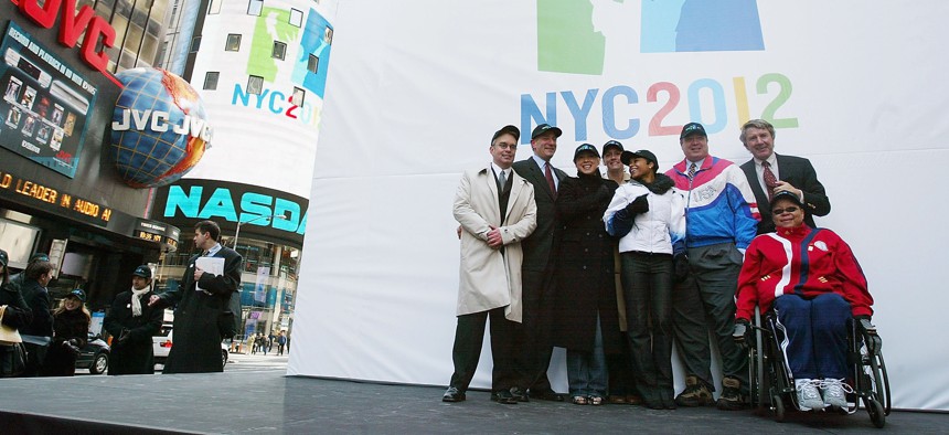 NYC2012 founder Dan Doctoroff, second from left, and Olympic athletes unveiled the bid’s logo in Times Square on April 5, 2004.