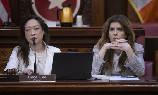 New York City Council Speaker Julie Menin and Council Member Linda Lee question administration officials at a budget hearing in June.