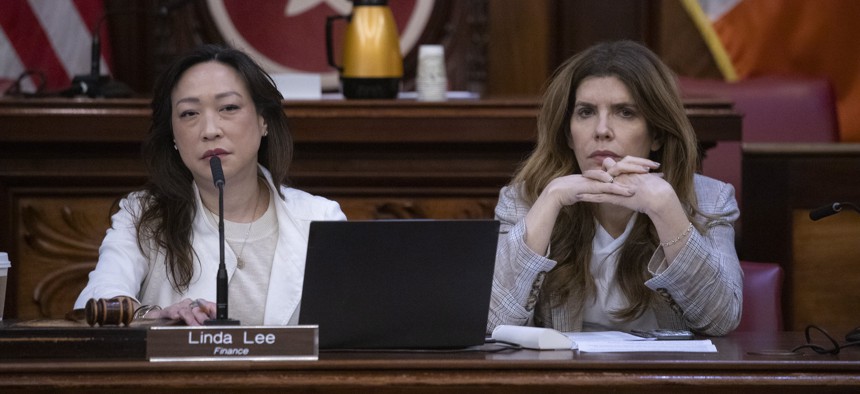 New York City Council Speaker Julie Menin and Council Member Linda Lee question administration officials at a budget hearing in June.