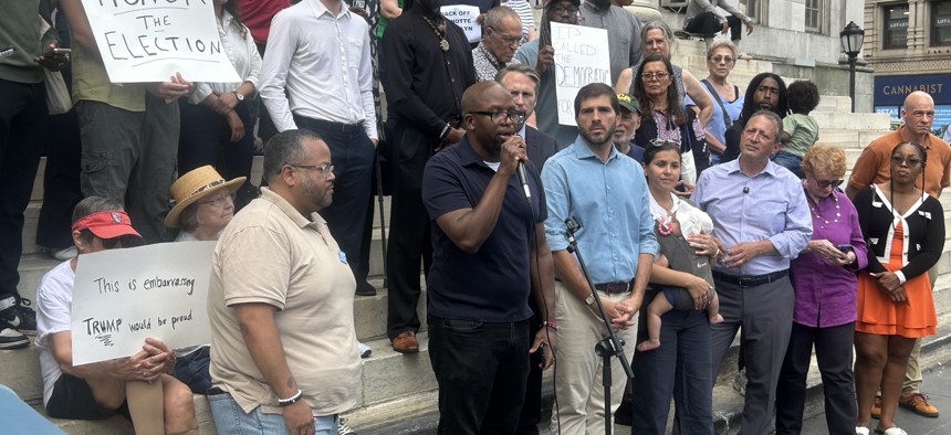 (L to R) District leaders Julio Peña III, Akel Williams, state Sen. Andrew Gounardes, district leader Ilyssa Meyer, congressional candidate Brad Lander, Assembly Member Jo Anne Simon and more Brooklyn Democrats rallied against proposed rules changes outside Brooklyn Borough Hall Monday.