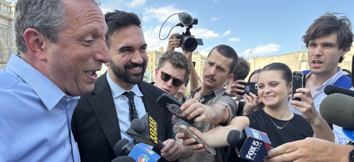 Reporters question New York City mayoral candidates Brad Lander and Zohran Mamdani in 2025.