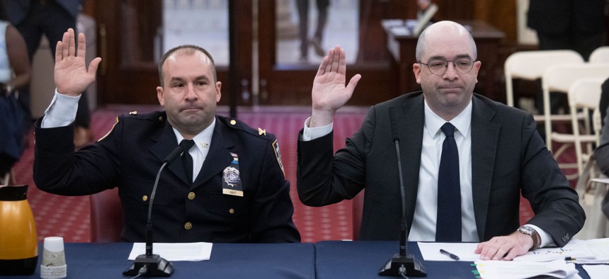 New York City Police Department Inspector William Haut and Deputy Commissioner of Legal Matters Michael Gerber testify at a City Council hearing on Wednesday.