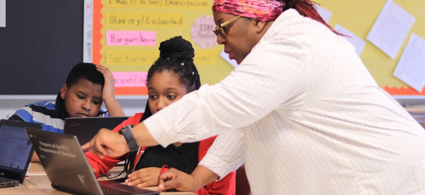 Students and a teacher at the Urban Assembly School of Applied Math and Science.