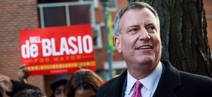 Then-New York City mayoral candidate Bill de Blasio campaigns in Brooklyn in November 2013.