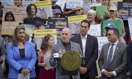 New York City Council Member Harvey Epstein speaks at a press conference in support of legislation protecting wild birds.