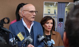 State Sen. Sam Sutton and Gov. Kathy Hochul speak at a press conference about antisemitism.