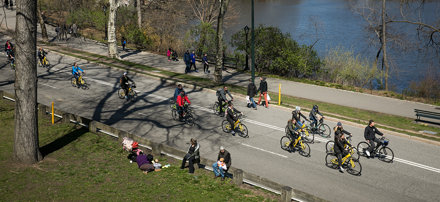 People ride bikes on West Drive in Central Park on April 20, 2018.
