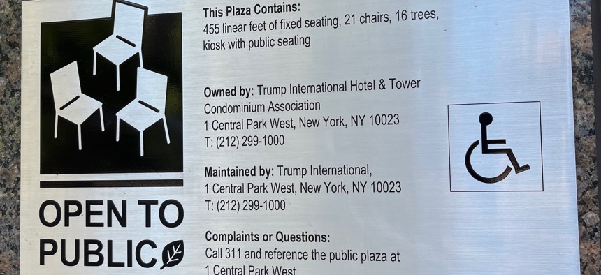 A sign outside the Trump International Hotel & Tower identifies the property’s privately owned public plaza.